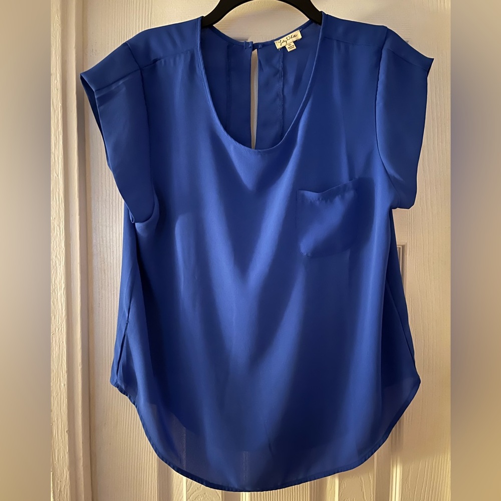 Royal blue short sleeve blouse with front pocket and back button